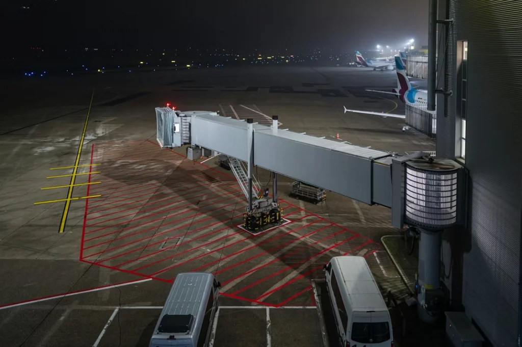 A jet bridge extending from the terminal to an aircraft parking area