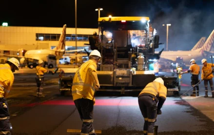 Airport maintenance workers performing runway maintenance