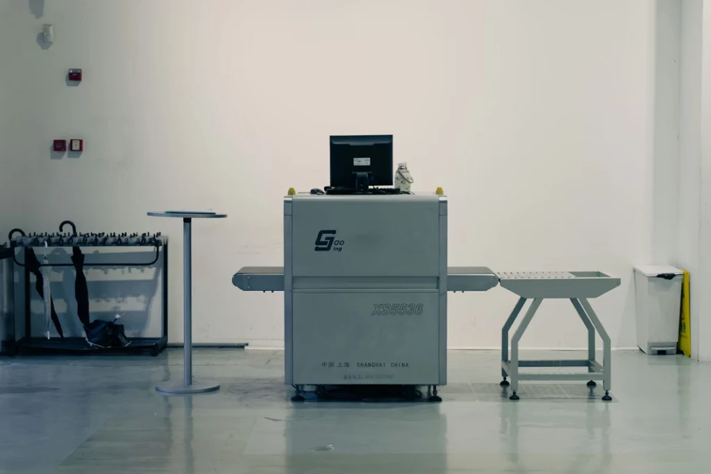 Industrial inspection machine with conveyor system used for equipment scanning and quality control in a facility