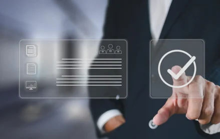 Business professional selecting a digital checkmark beside a compliance dashboard, representing verification of CMMC Level 2 cybersecurity requirements.