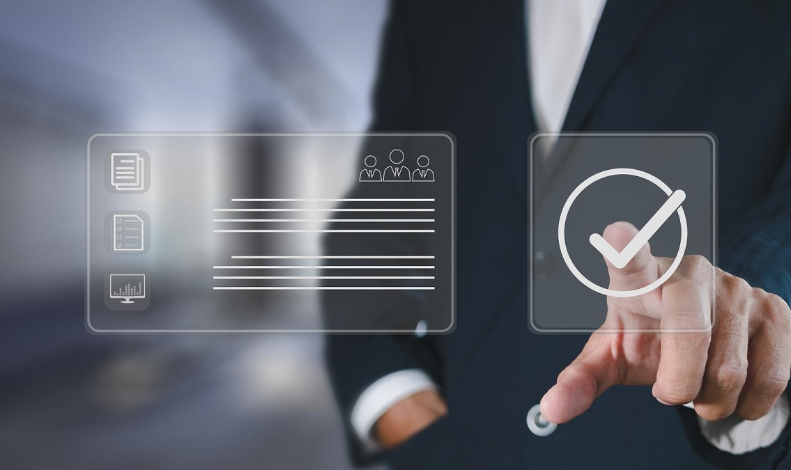 Business professional selecting a digital checkmark beside a compliance dashboard, representing verification of CMMC Level 2 cybersecurity requirements.